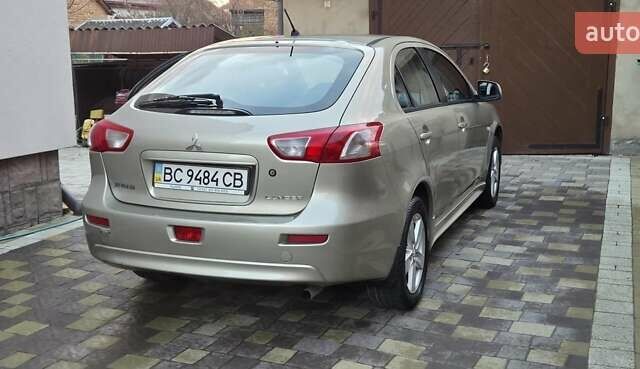 Бежевий Міцубісі Lancer, об'ємом двигуна 1.8 л та пробігом 204 тис. км за 7500 $, фото 1 на Automoto.ua