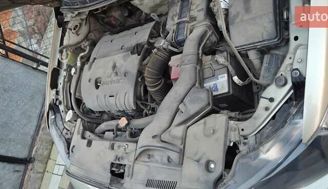 Бежевий Міцубісі Lancer, об'ємом двигуна 1.8 л та пробігом 204 тис. км за 7500 $, фото 12 на Automoto.ua