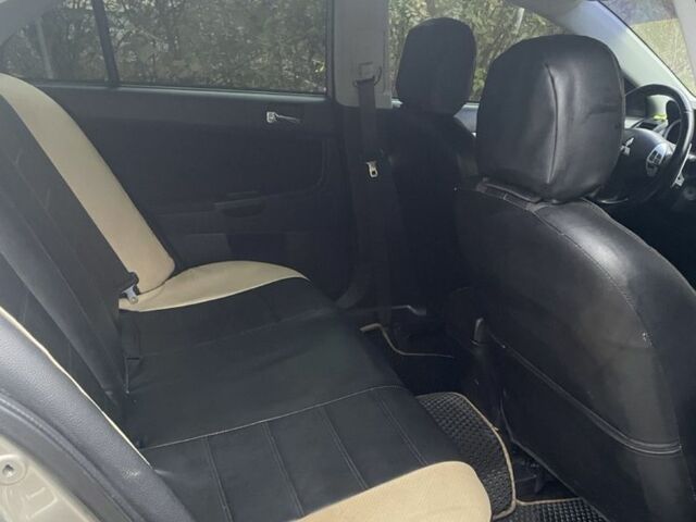 Бежевий Міцубісі Lancer, об'ємом двигуна 2 л та пробігом 290 тис. км за 6000 $, фото 6 на Automoto.ua