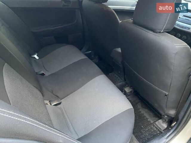 Бежевый Мицубиси Лансер, объемом двигателя 1.5 л и пробегом 242 тыс. км за 5999 $, фото 24 на Automoto.ua