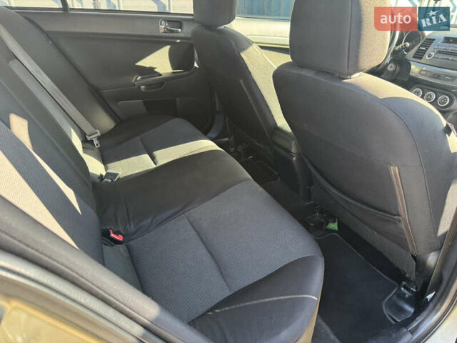 Бежевый Мицубиси Лансер, объемом двигателя 2 л и пробегом 238 тыс. км за 5500 $, фото 11 на Automoto.ua