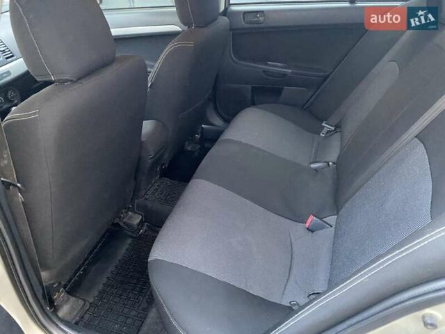 Бежевый Мицубиси Лансер, объемом двигателя 1.5 л и пробегом 242 тыс. км за 5999 $, фото 25 на Automoto.ua