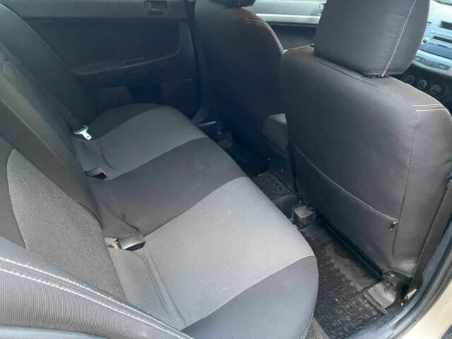 Бежевый Мицубиси Лансер, объемом двигателя 1.5 л и пробегом 242 тыс. км за 5999 $, фото 7 на Automoto.ua