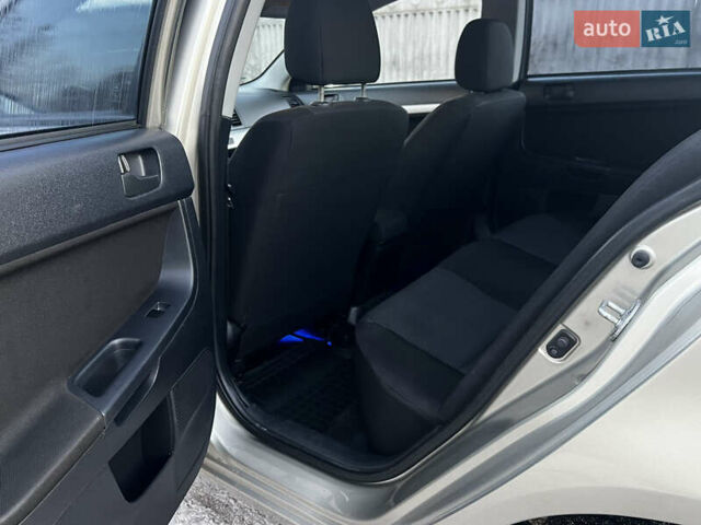 Бежевий Міцубісі Lancer, об'ємом двигуна 1.5 л та пробігом 206 тис. км за 5989 $, фото 6 на Automoto.ua