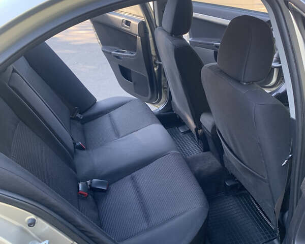 Бежевий Міцубісі Lancer, об'ємом двигуна 1.5 л та пробігом 225 тис. км за 5700 $, фото 9 на Automoto.ua