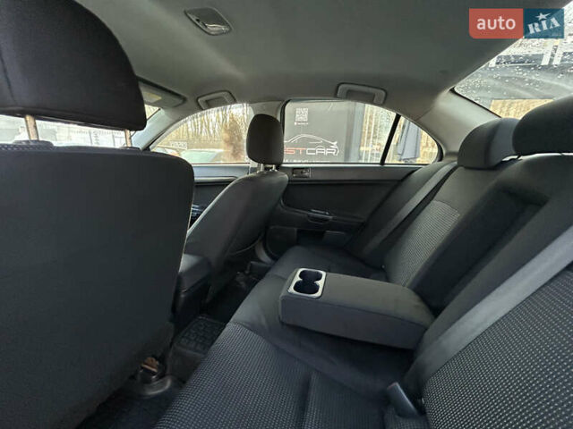 Бежевий Міцубісі Lancer, об'ємом двигуна 2 л та пробігом 250 тис. км за 8400 $, фото 22 на Automoto.ua