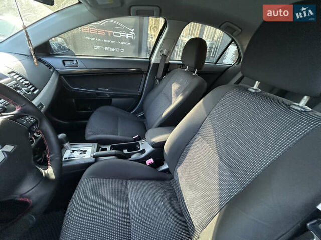 Бежевий Міцубісі Lancer, об'ємом двигуна 2 л та пробігом 250 тис. км за 8400 $, фото 16 на Automoto.ua