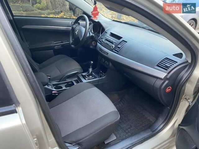 Бежевый Мицубиси Лансер, объемом двигателя 1.5 л и пробегом 242 тыс. км за 5999 $, фото 21 на Automoto.ua