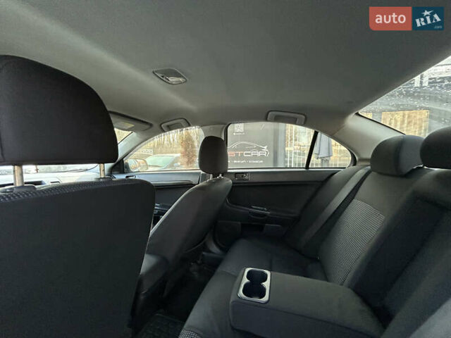 Бежевий Міцубісі Lancer, об'ємом двигуна 2 л та пробігом 250 тис. км за 8400 $, фото 23 на Automoto.ua