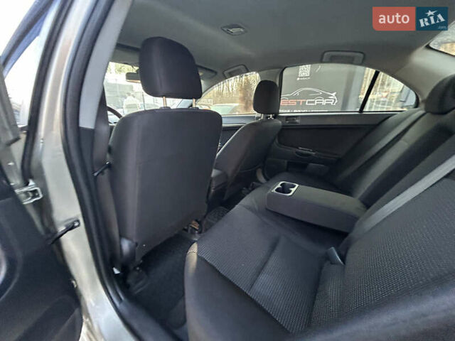 Бежевий Міцубісі Lancer, об'ємом двигуна 2 л та пробігом 250 тис. км за 8400 $, фото 21 на Automoto.ua