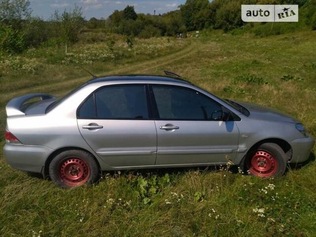 Бежевий Міцубісі Lancer, об'ємом двигуна 1.6 л та пробігом 200 тис. км за 3700 $, фото 9 на Automoto.ua