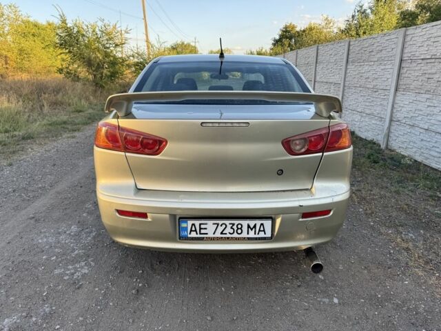 Бежевий Міцубісі Lancer, об'ємом двигуна 2 л та пробігом 240 тис. км за 4300 $, фото 3 на Automoto.ua