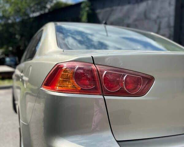 Бежевий Міцубісі Lancer, об'ємом двигуна 2 л та пробігом 163 тис. км за 7700 $, фото 3 на Automoto.ua