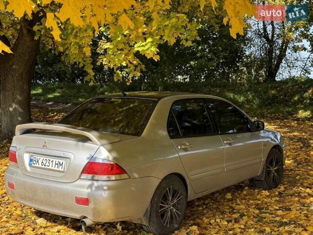 Бежевий Міцубісі Lancer, об'ємом двигуна 1.6 л та пробігом 200 тис. км за 3700 $, фото 14 на Automoto.ua