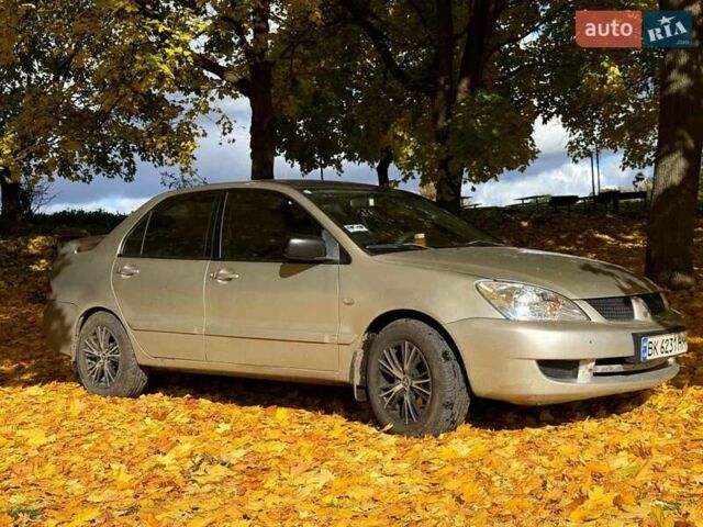 Бежевий Міцубісі Lancer, об'ємом двигуна 1.6 л та пробігом 200 тис. км за 3700 $, фото 12 на Automoto.ua