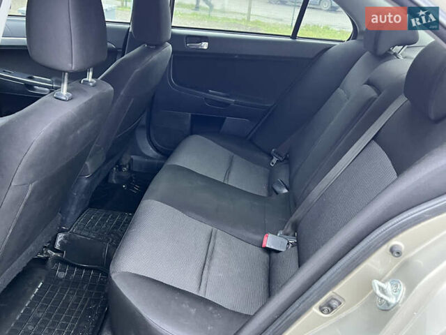Бежевий Міцубісі Lancer, об'ємом двигуна 2 л та пробігом 262 тис. км за 6000 $, фото 13 на Automoto.ua
