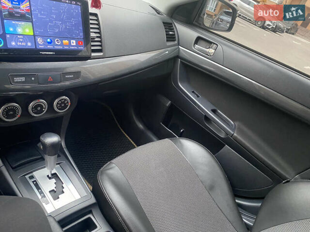 Бежевий Міцубісі Lancer, об'ємом двигуна 2 л та пробігом 173 тис. км за 7500 $, фото 10 на Automoto.ua