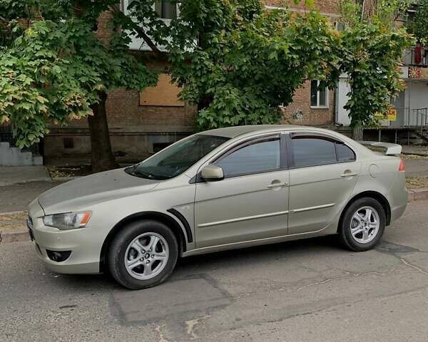 Бежевий Міцубісі Lancer, об'ємом двигуна 2 л та пробігом 212 тис. км за 6300 $, фото 6 на Automoto.ua