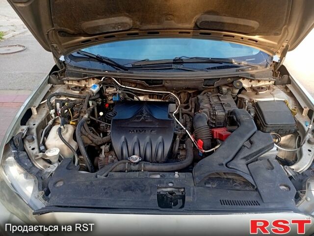 Бежевий Міцубісі Lancer, об'ємом двигуна 1.5 л та пробігом 200 тис. км за 3650 $, фото 6 на Automoto.ua