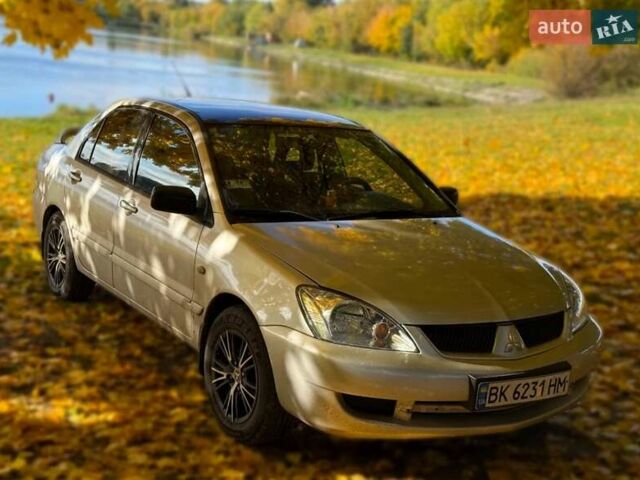 Бежевий Міцубісі Lancer, об'ємом двигуна 1.6 л та пробігом 200 тис. км за 3700 $, фото 11 на Automoto.ua