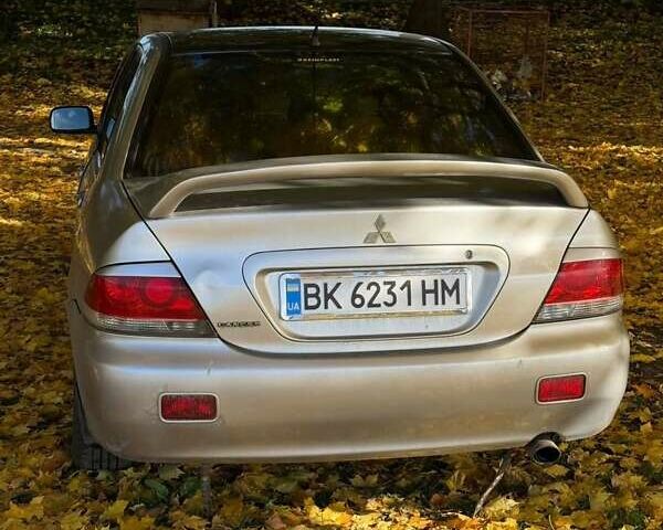 Бежевий Міцубісі Lancer, об'ємом двигуна 1.6 л та пробігом 200 тис. км за 3700 $, фото 16 на Automoto.ua