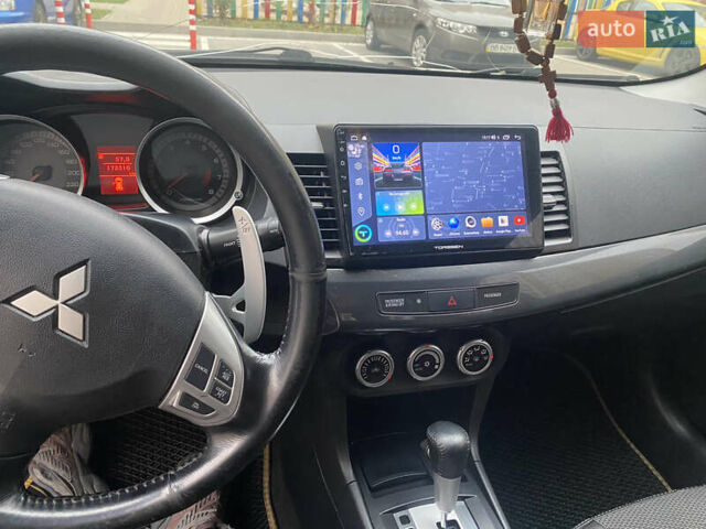 Бежевий Міцубісі Lancer, об'ємом двигуна 2 л та пробігом 173 тис. км за 7500 $, фото 9 на Automoto.ua