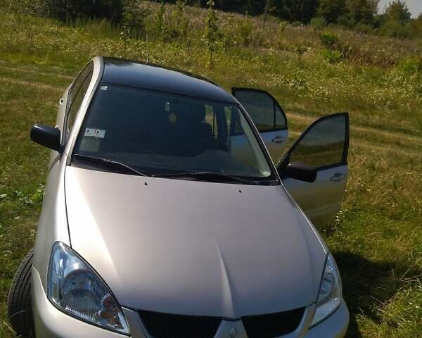 Бежевий Міцубісі Lancer, об'ємом двигуна 1.6 л та пробігом 200 тис. км за 3700 $, фото 10 на Automoto.ua