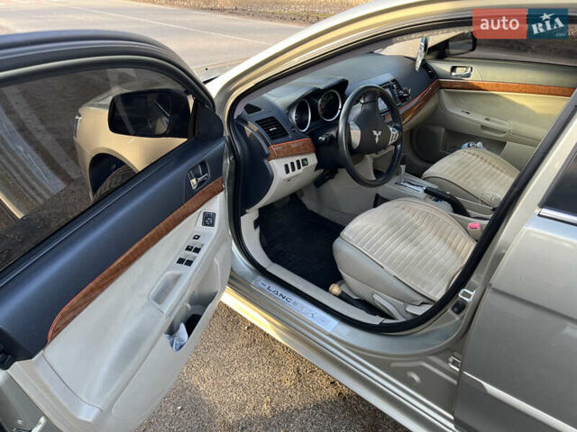 Бежевый Мицубиси Лансер, объемом двигателя 1.5 л и пробегом 200 тыс. км за 8500 $, фото 5 на Automoto.ua