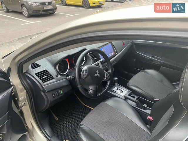 Бежевий Міцубісі Lancer, об'ємом двигуна 2 л та пробігом 173 тис. км за 7500 $, фото 1 на Automoto.ua