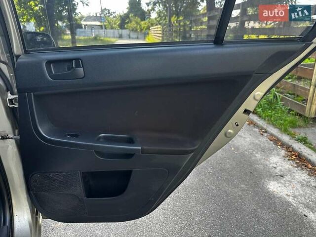 Бежевый Мицубиси Лансер, объемом двигателя 1.5 л и пробегом 192 тыс. км за 6690 $, фото 18 на Automoto.ua