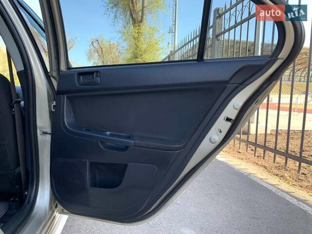 Бежевий Міцубісі Lancer, об'ємом двигуна 2 л та пробігом 175 тис. км за 7650 $, фото 36 на Automoto.ua