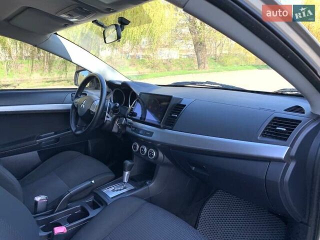 Бежевий Міцубісі Lancer, об'ємом двигуна 2 л та пробігом 175 тис. км за 7650 $, фото 29 на Automoto.ua