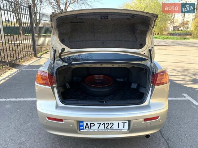 Бежевий Міцубісі Lancer, об'ємом двигуна 2 л та пробігом 175 тис. км за 7650 $, фото 41 на Automoto.ua