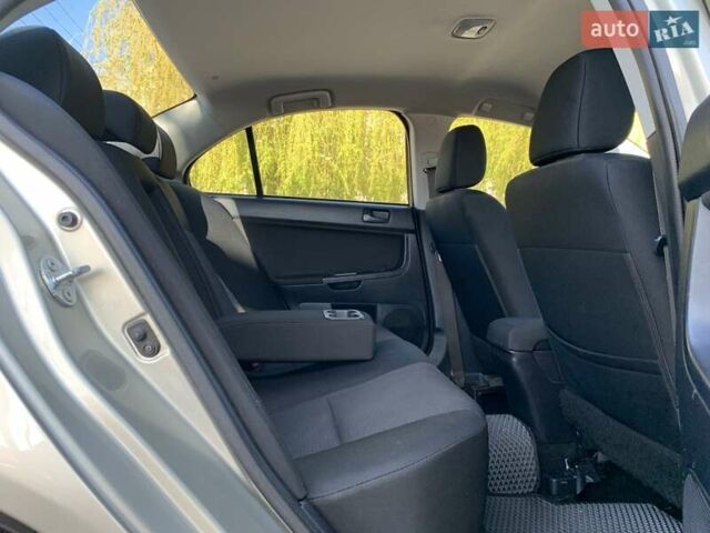 Бежевий Міцубісі Lancer, об'ємом двигуна 2 л та пробігом 175 тис. км за 7650 $, фото 38 на Automoto.ua