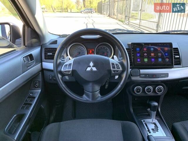 Бежевий Міцубісі Lancer, об'ємом двигуна 2 л та пробігом 175 тис. км за 7650 $, фото 23 на Automoto.ua
