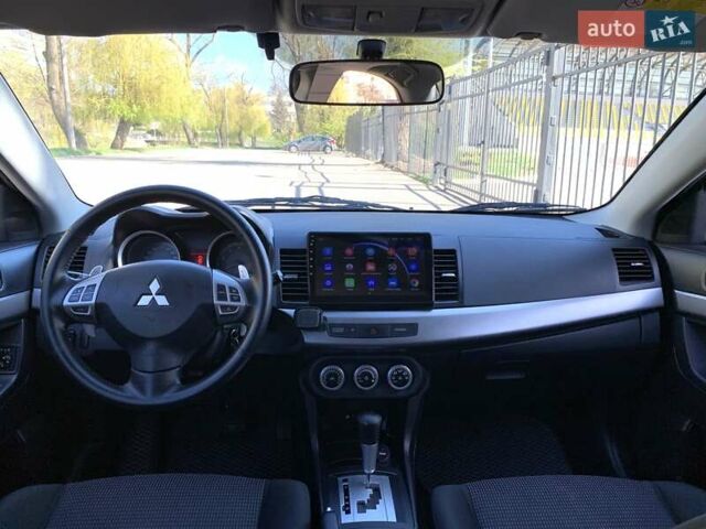 Бежевий Міцубісі Lancer, об'ємом двигуна 2 л та пробігом 175 тис. км за 7650 $, фото 33 на Automoto.ua