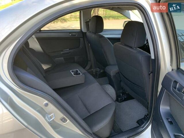 Бежевий Міцубісі Lancer, об'ємом двигуна 2 л та пробігом 175 тис. км за 7650 $, фото 37 на Automoto.ua