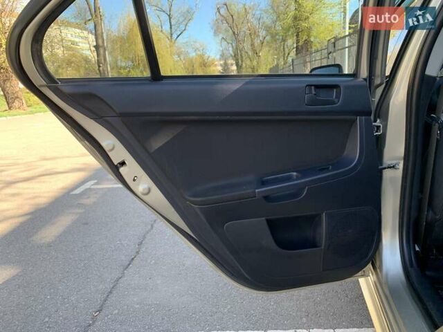 Бежевий Міцубісі Lancer, об'ємом двигуна 2 л та пробігом 175 тис. км за 7650 $, фото 39 на Automoto.ua