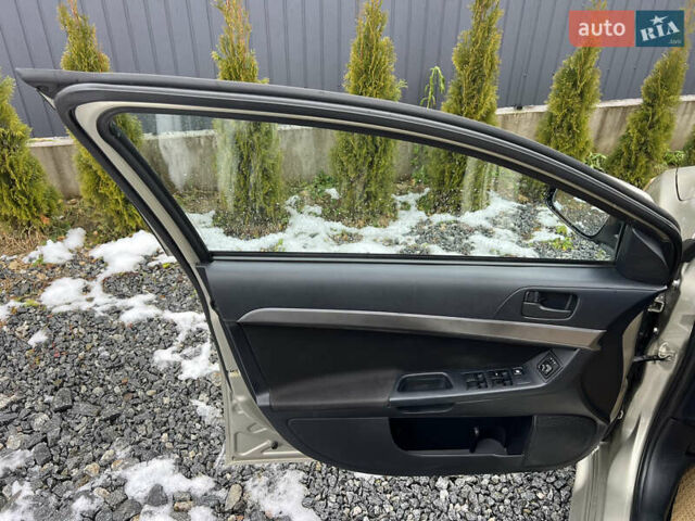 Бежевий Міцубісі Lancer, об'ємом двигуна 1.5 л та пробігом 245 тис. км за 6499 $, фото 14 на Automoto.ua