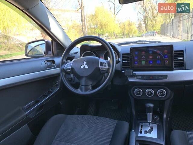 Бежевий Міцубісі Lancer, об'ємом двигуна 2 л та пробігом 175 тис. км за 7650 $, фото 34 на Automoto.ua