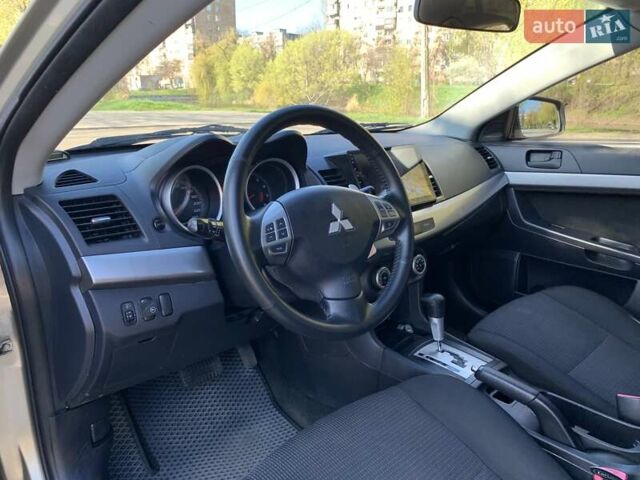 Бежевий Міцубісі Lancer, об'ємом двигуна 2 л та пробігом 175 тис. км за 7650 $, фото 20 на Automoto.ua