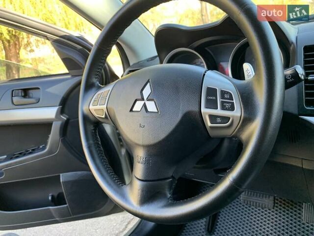 Бежевий Міцубісі Lancer, об'ємом двигуна 2 л та пробігом 175 тис. км за 7650 $, фото 25 на Automoto.ua