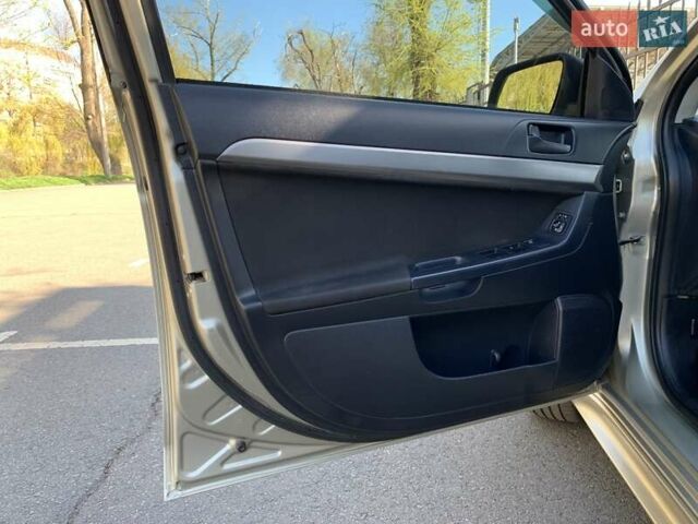 Бежевий Міцубісі Lancer, об'ємом двигуна 2 л та пробігом 175 тис. км за 7650 $, фото 19 на Automoto.ua