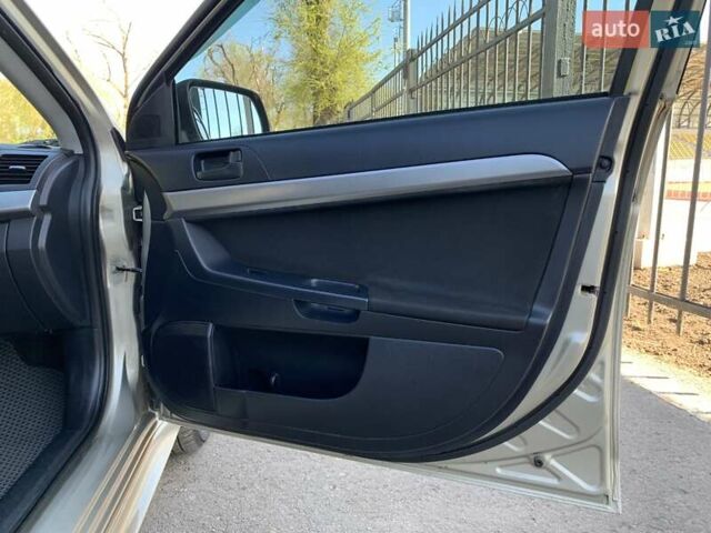 Бежевий Міцубісі Lancer, об'ємом двигуна 2 л та пробігом 175 тис. км за 7650 $, фото 28 на Automoto.ua