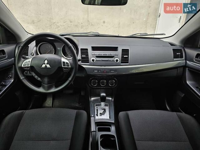 Бежевий Міцубісі Lancer, об'ємом двигуна 2 л та пробігом 191 тис. км за 8200 $, фото 33 на Automoto.ua