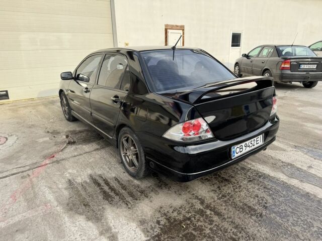 Черный Мицубиси Лансер, объемом двигателя 2 л и пробегом 3 тыс. км за 3700 $, фото 1 на Automoto.ua