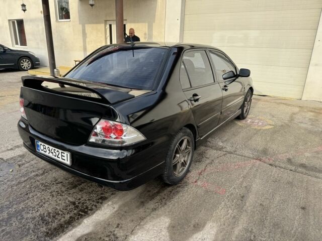 Черный Мицубиси Лансер, объемом двигателя 2 л и пробегом 3 тыс. км за 3700 $, фото 2 на Automoto.ua