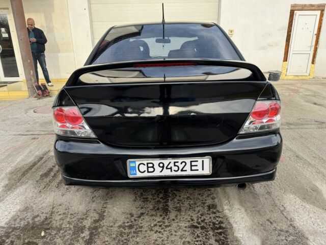 Черный Мицубиси Лансер, объемом двигателя 2 л и пробегом 3 тыс. км за 3700 $, фото 3 на Automoto.ua