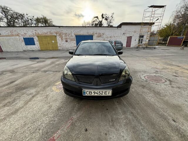 Черный Мицубиси Лансер, объемом двигателя 2 л и пробегом 3 тыс. км за 3700 $, фото 7 на Automoto.ua