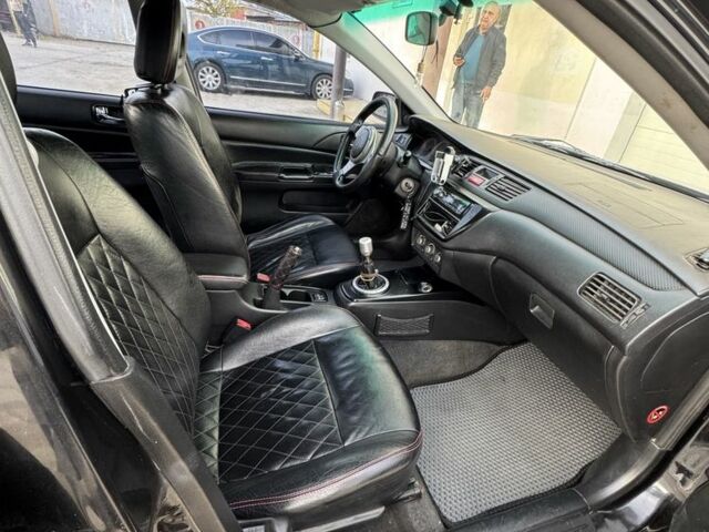 Черный Мицубиси Лансер, объемом двигателя 2 л и пробегом 3 тыс. км за 3700 $, фото 5 на Automoto.ua